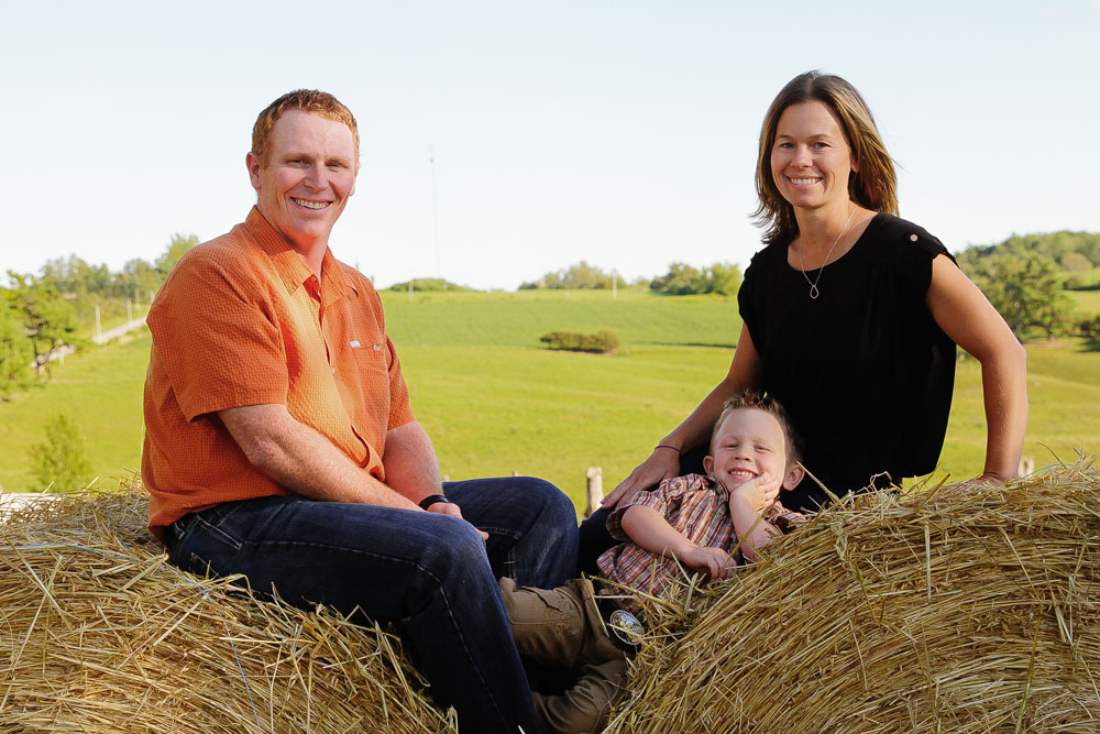 Darold and Kara Enright with young Corben on the their beef farm near Tweed, Ontario. Now, there is second young one, Evelyn.